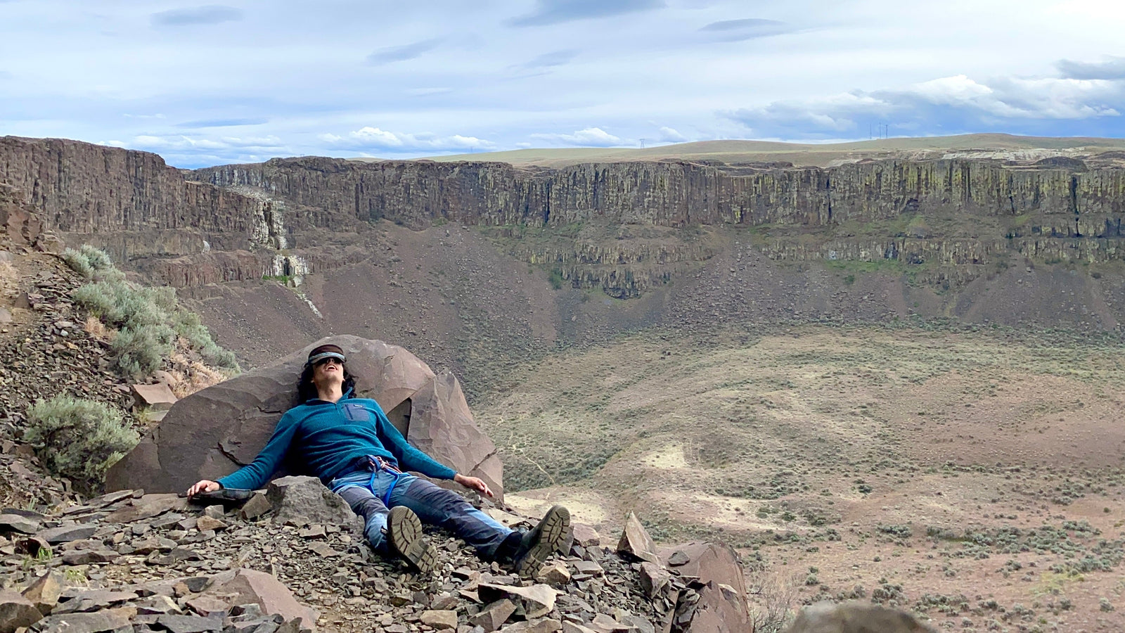 Ben rests at the top of a long rock climb